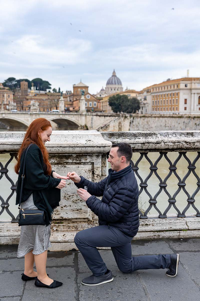 Surprise wedding proposal photographed on the Castel Sant'Angelo bridge in Rome Italy