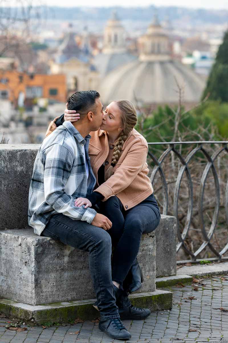 Couple kissing during an engagement photo shoot