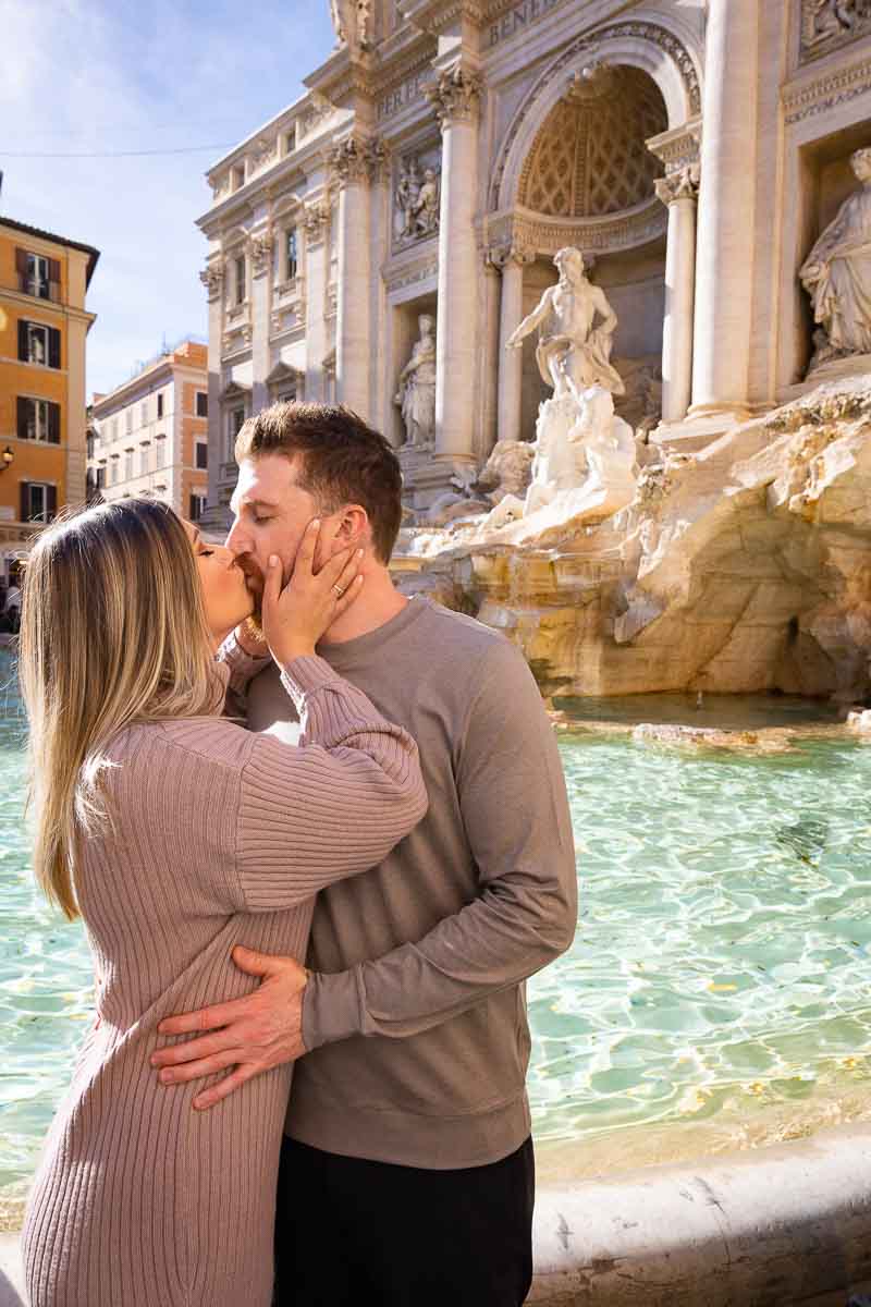 Couple romantically kissing at the Trevi fountain. One of the most scenic location. Image taken during a couple photo shoot