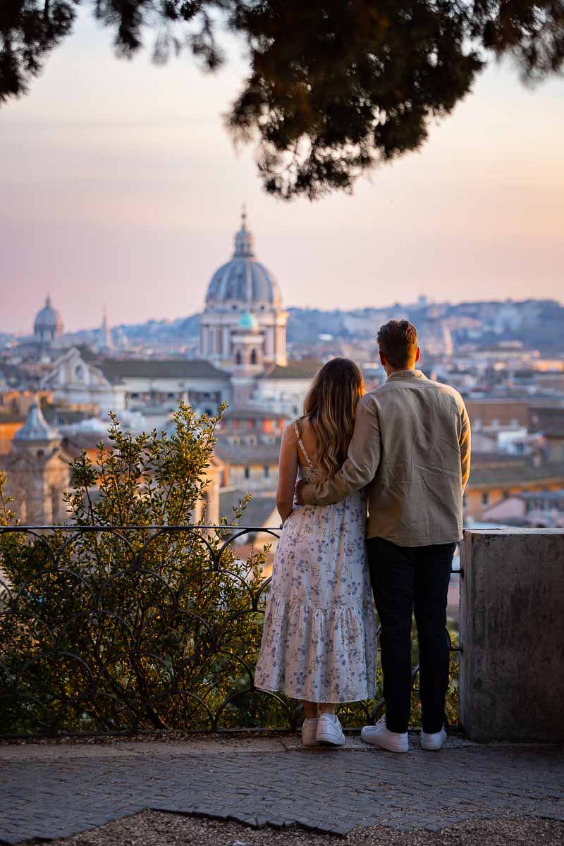 Just engaged. Couple enjoying the while of the Rome cityscape during a photography session