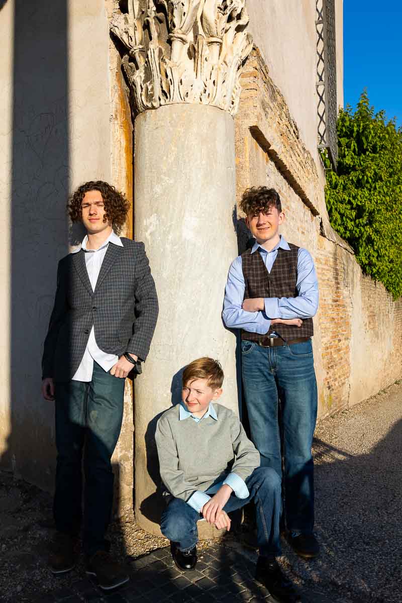 Kids group portrait taken under a roman column in Italy