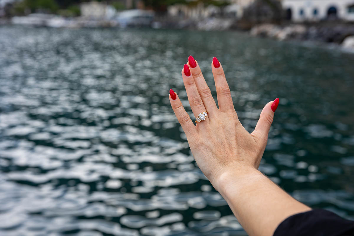 008-engagement-ring-water Looking at the amazing engagement ring during a couple photoshoot