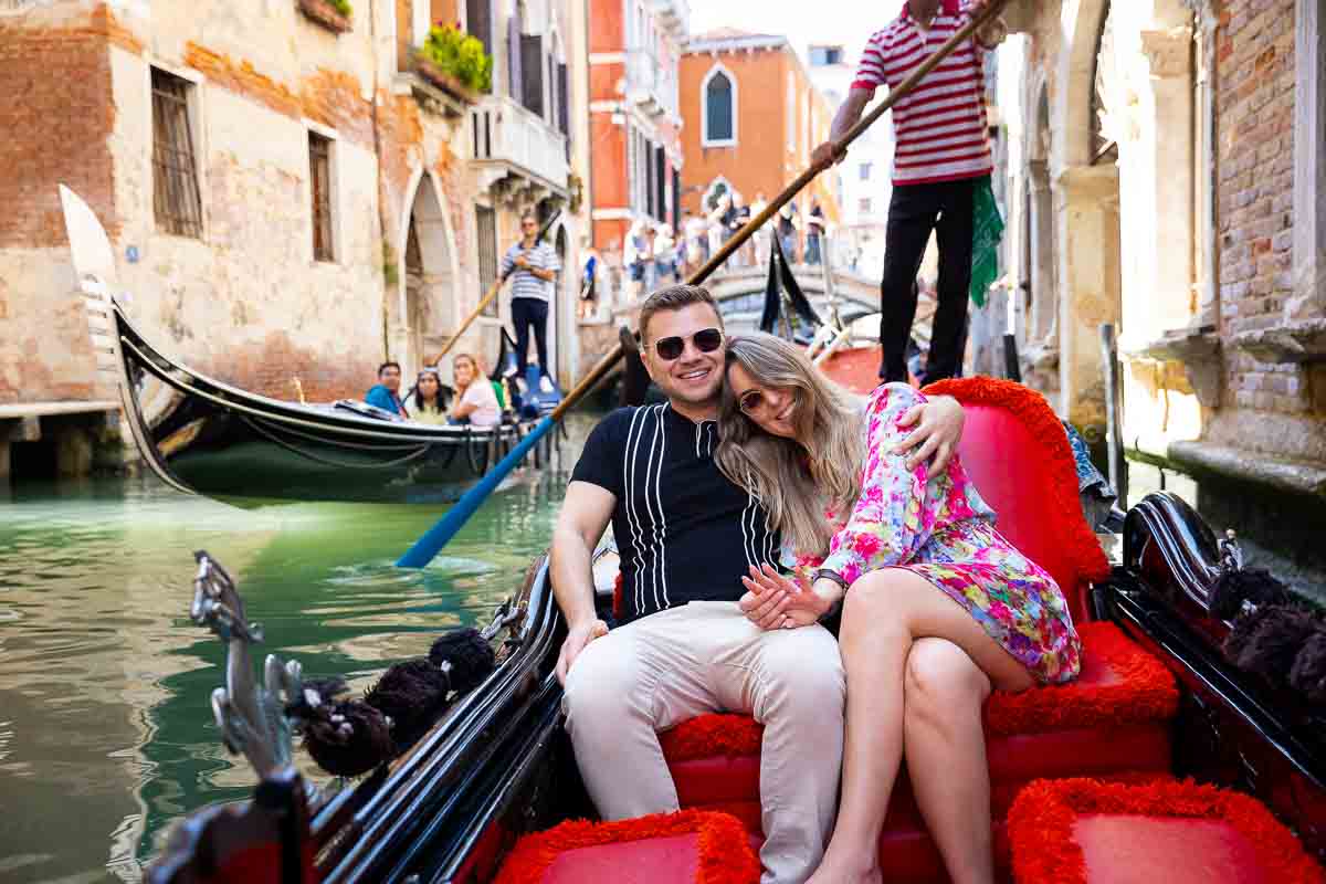 Admiring the engagement ring during a ride through the canals