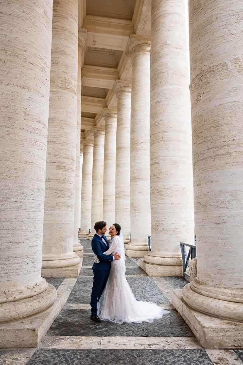Posed picture taken underneath the columns found in Saint Peter's square Vatican found in Italy