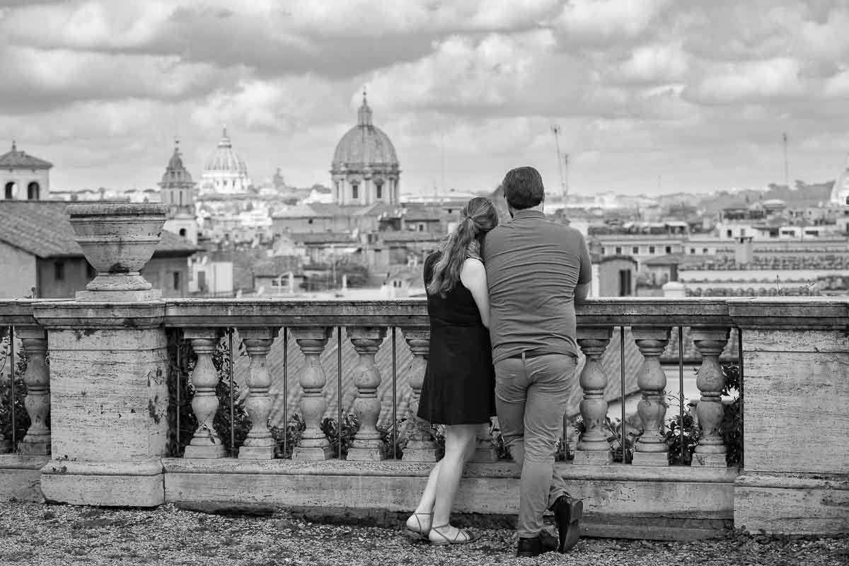 Black and white photoshoot of a couple observing the sweeping view