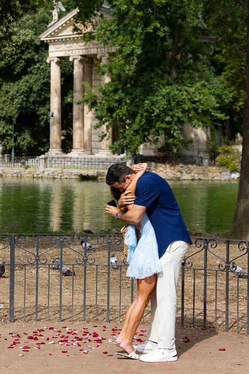 Overwhelming joy and happiness after a Rome proposal candidly photographed at the Villa Borghese lake