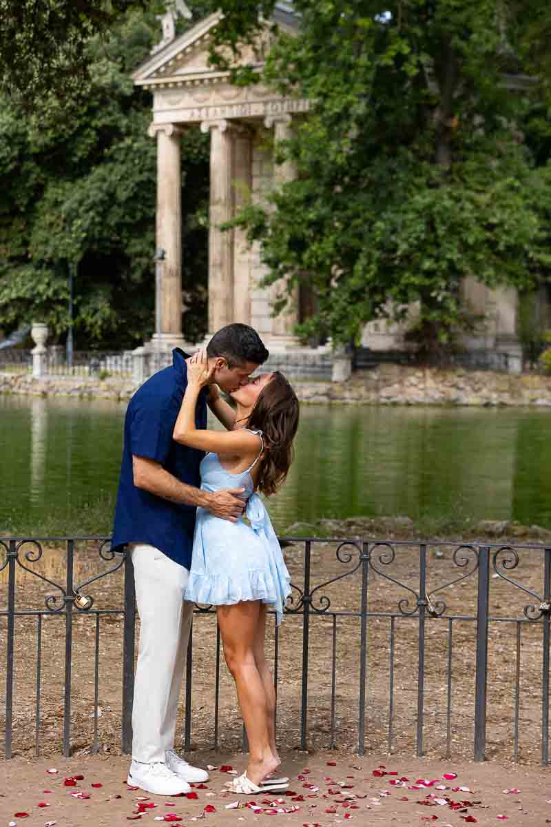 Just engaged at the Villa Borghese park in Rome Italy with the lake view in the backdrop
