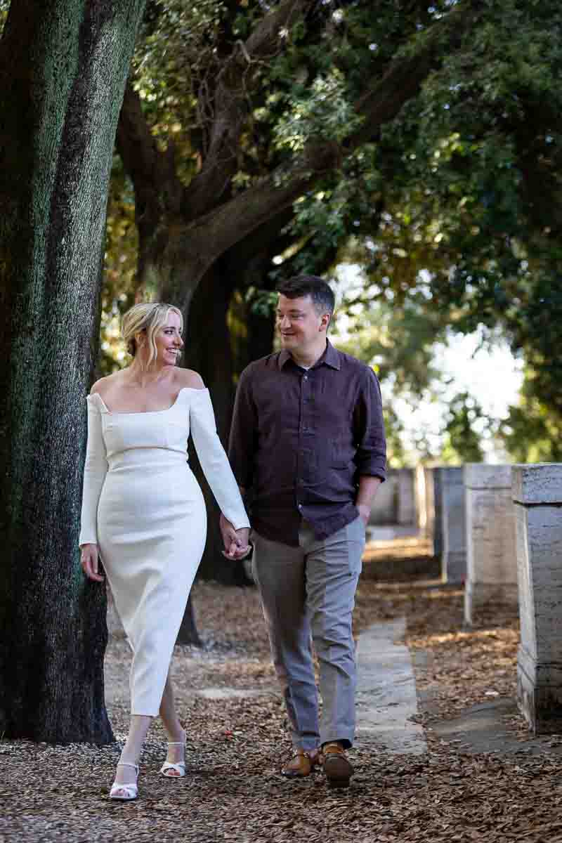 Walking during an engagement photo shoot in Villa Borghese