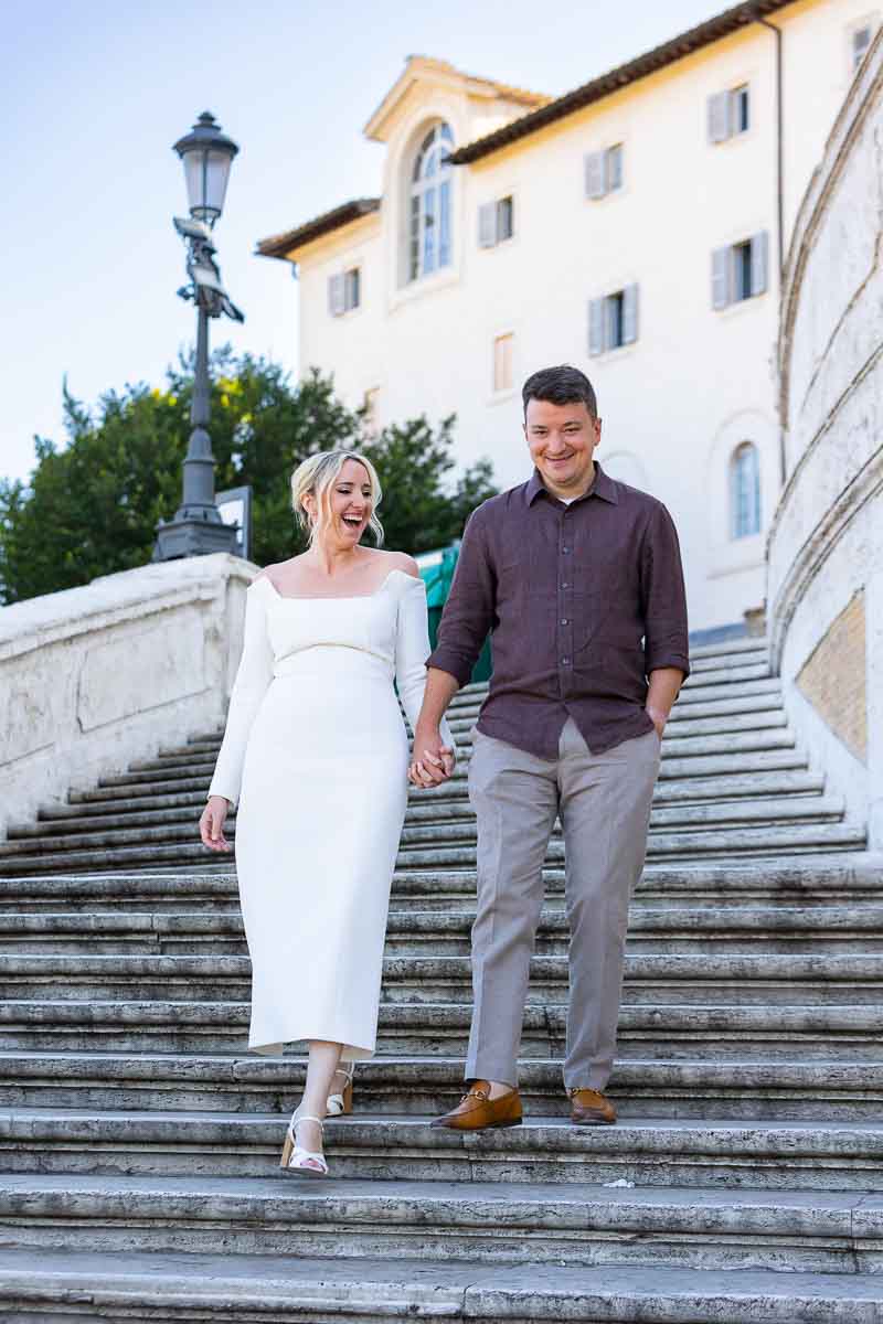 Walking down the Spanish steps holding hands