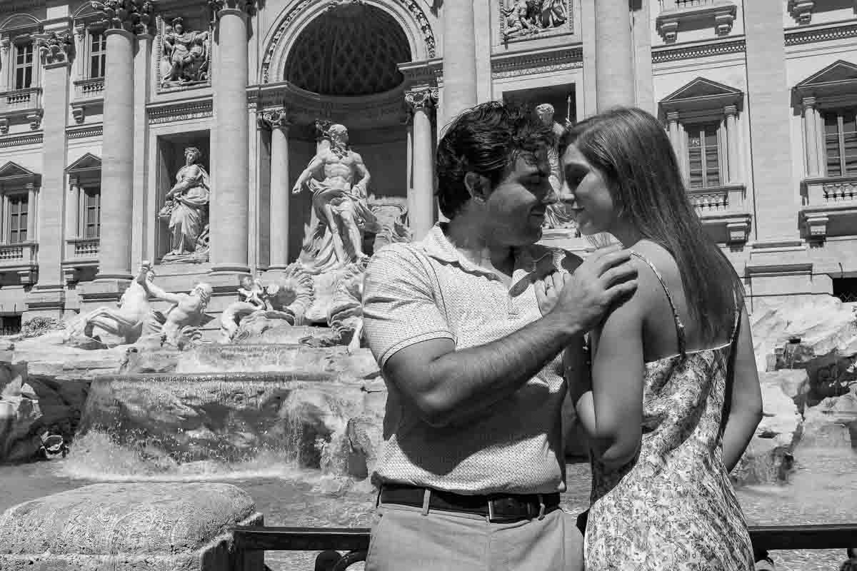 Romantically kissing at the Trevi fountain