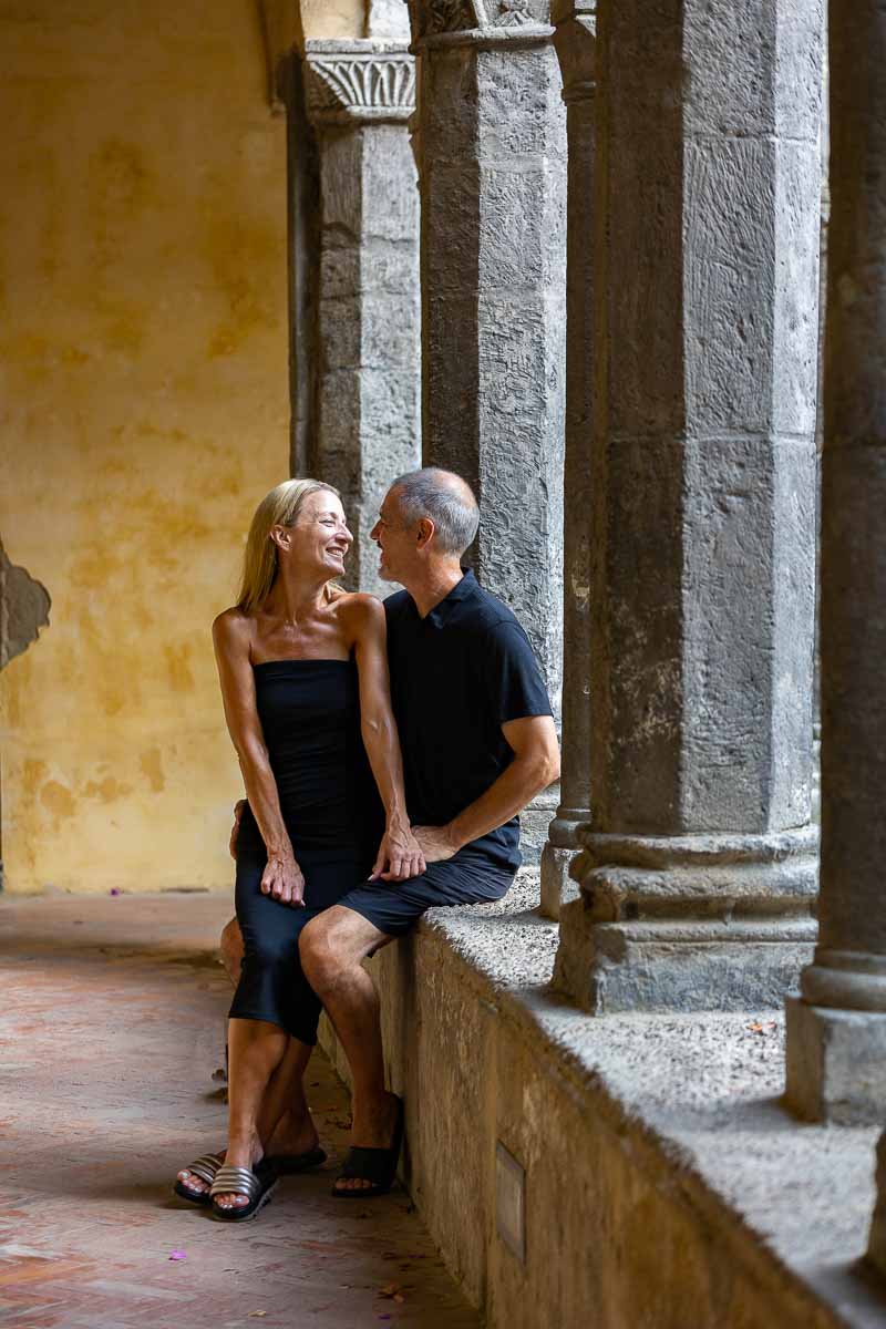 Couple lifestyle photography sitting down underneath the ancient town cloister