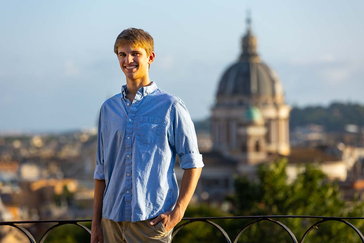 Male senior picture photography taken at the Pincio park terrace overlooking the roman skyline