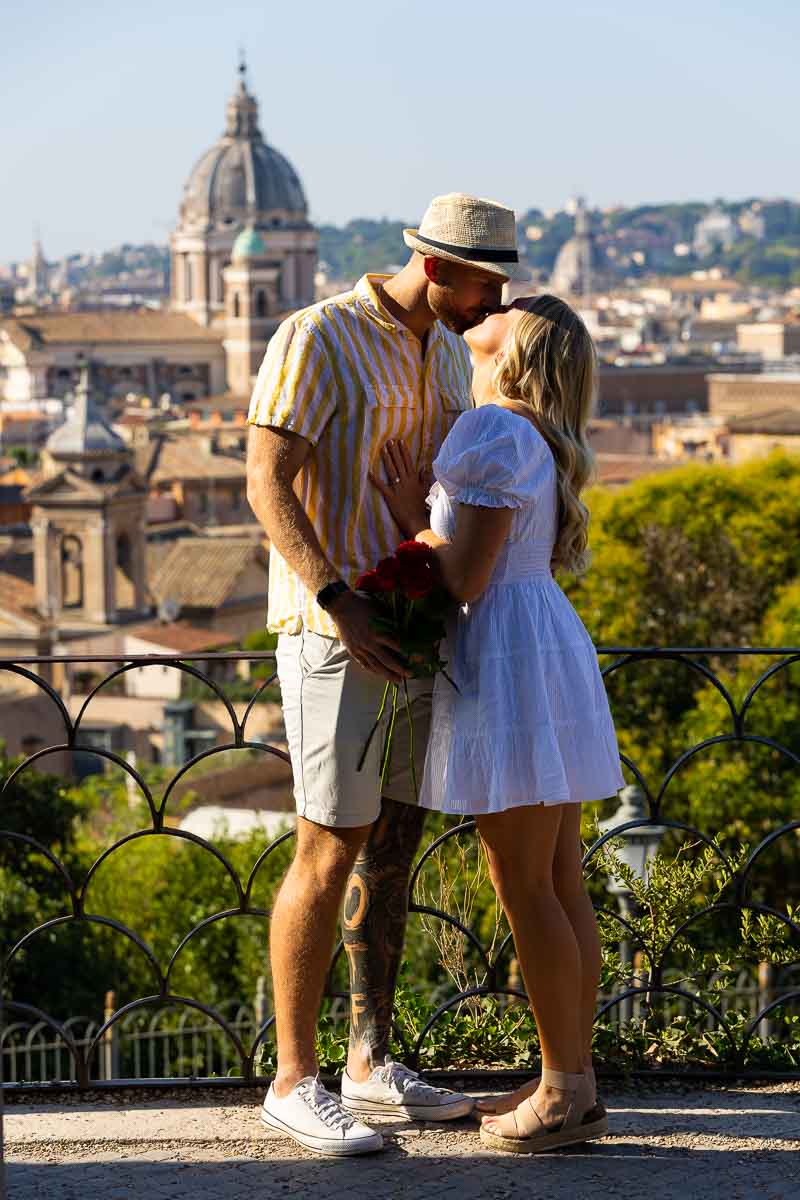 Couple kissing during a photo session Pincio park terrace