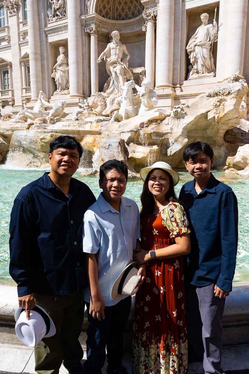 Posed portrait photographed at the Trevi fountain during daytime