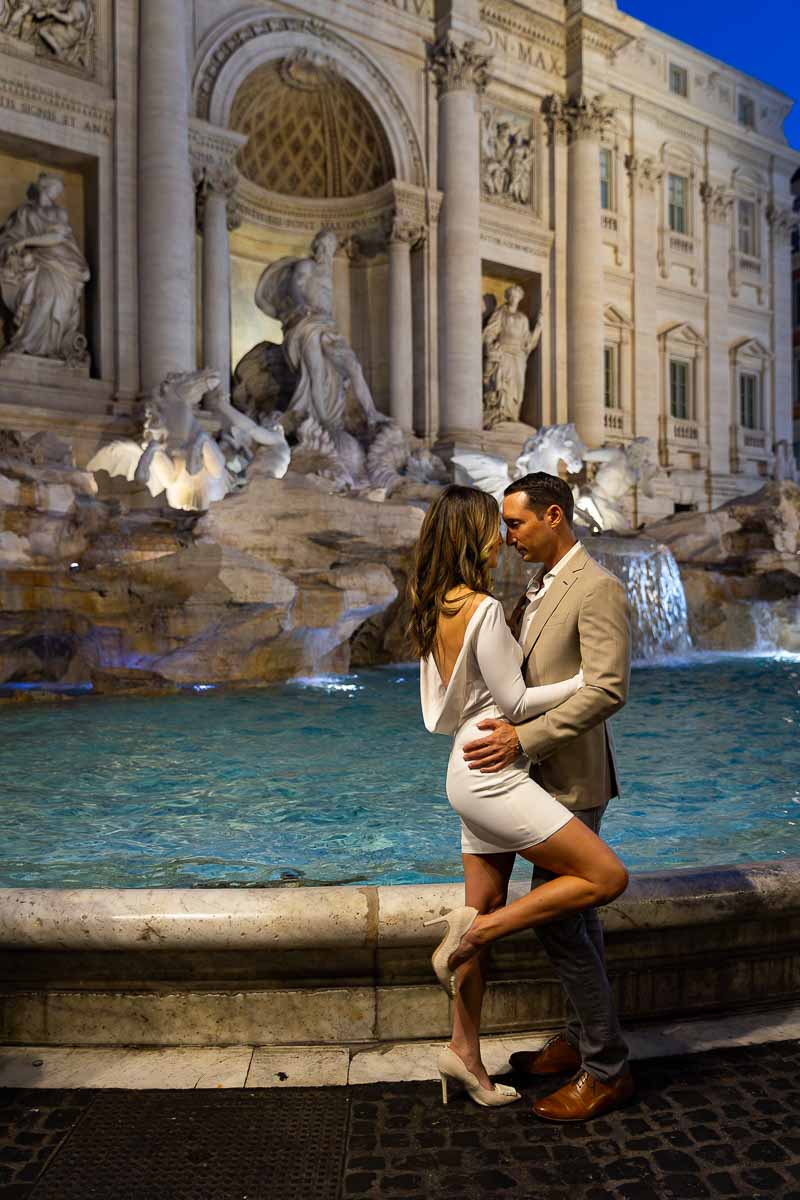 Couple portrait picture taken by Trevi fountain Rome Italy