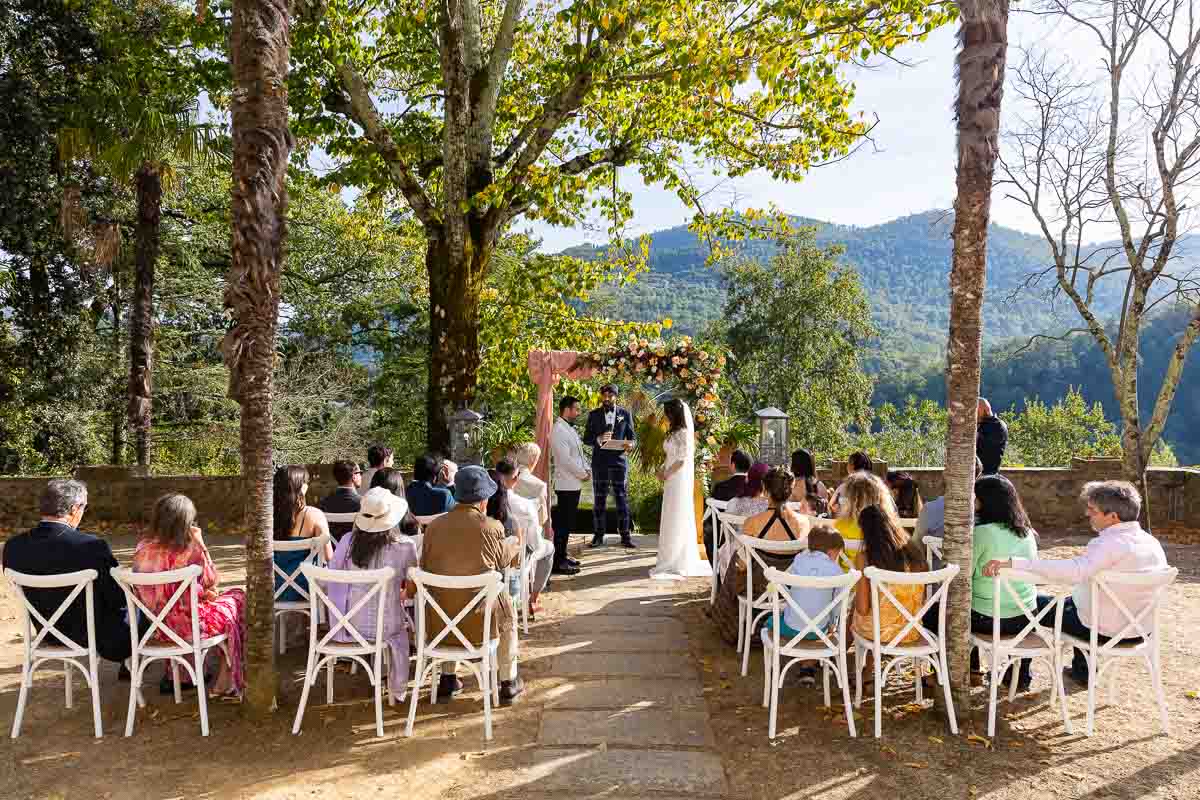 The outdoor ceremony with the bride and groom in a scenic tuscan villa
