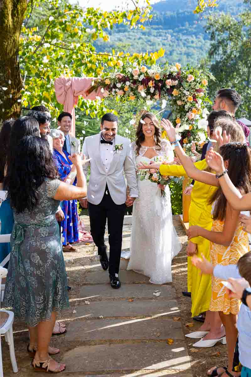 Bride and groom just married exit from the ceremony