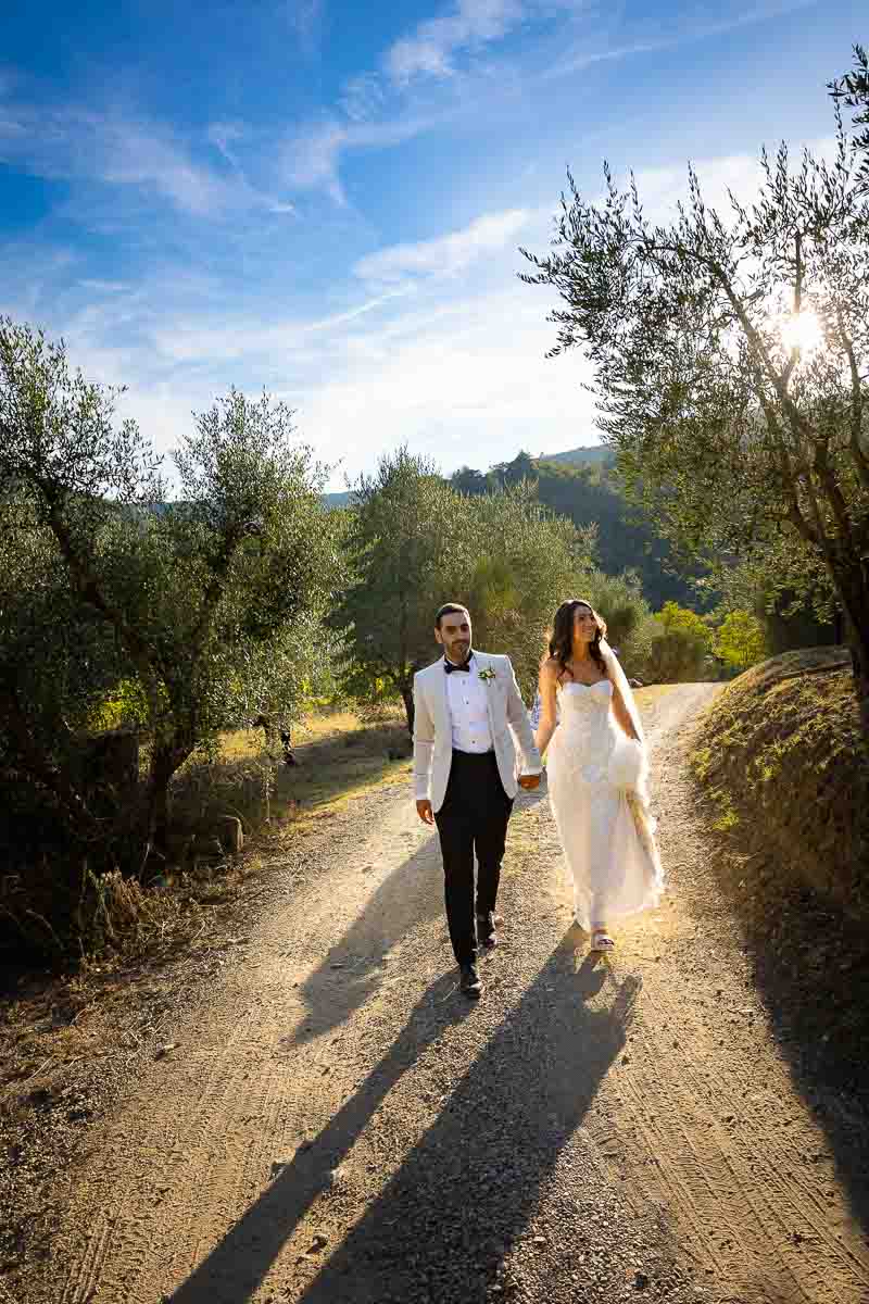 Newlyweds walking together after having taken their pictures together married 