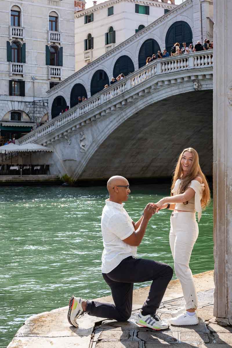 Joy and happiness after a romantic and candid marriage promise photographed from afar