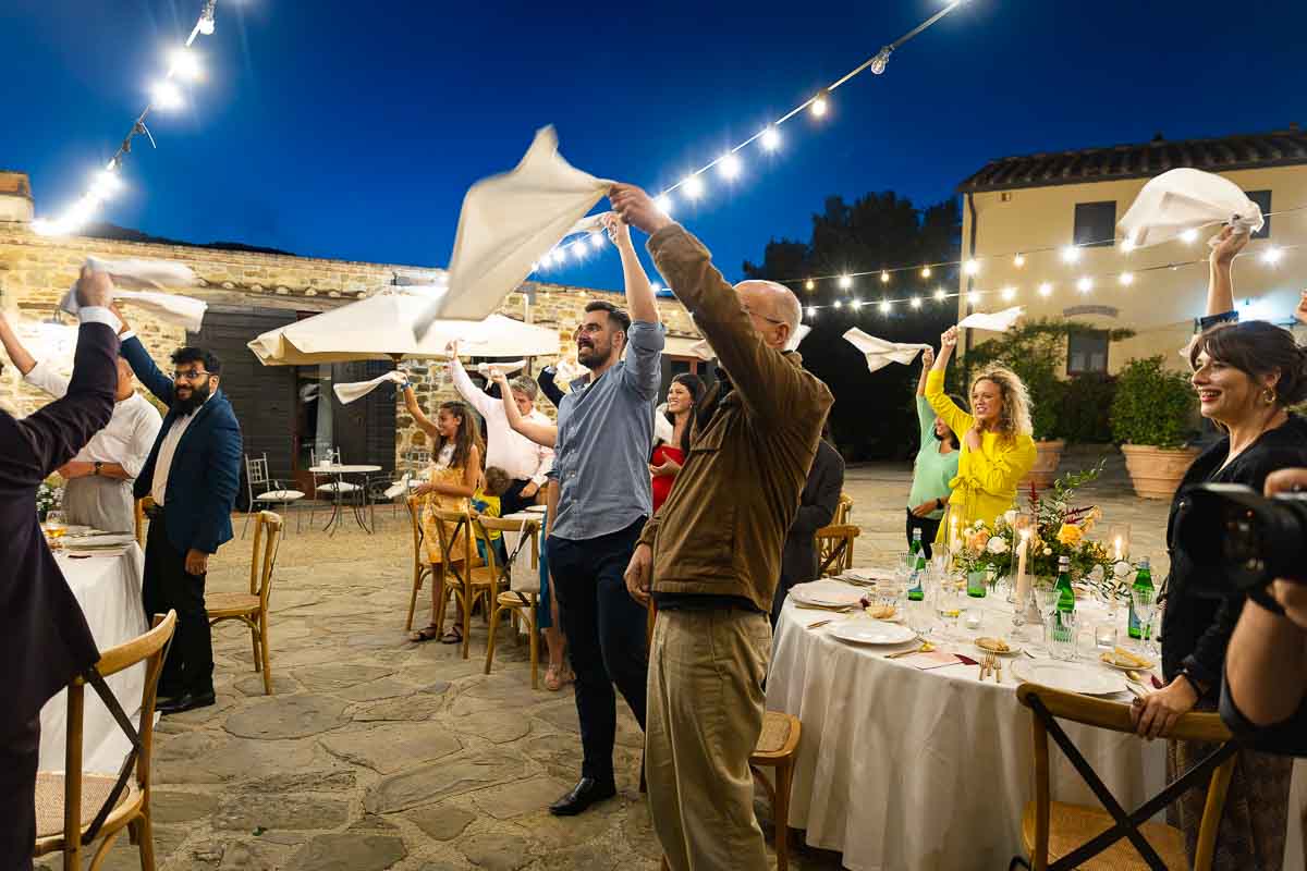 Guests welcoming the entrance of the newlyweds 