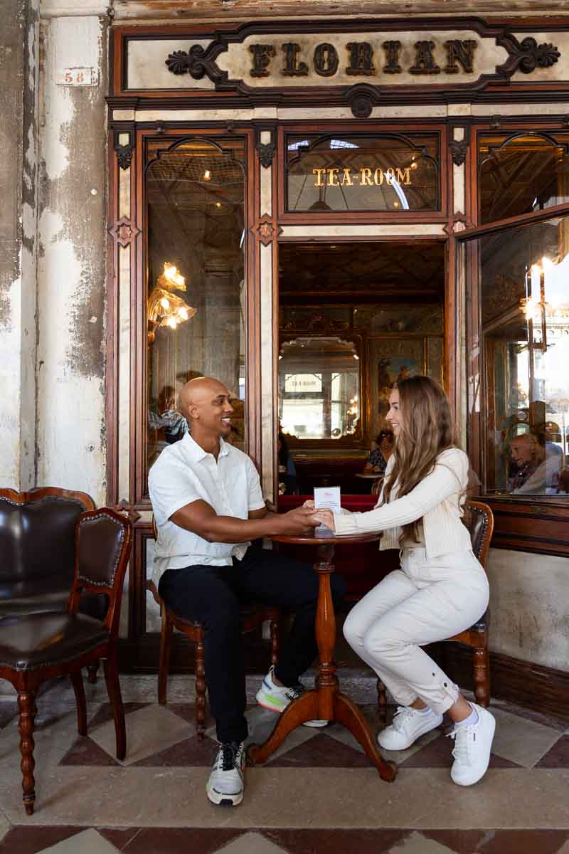 Sitting down together Florian Cafè during an engagement photo shoot