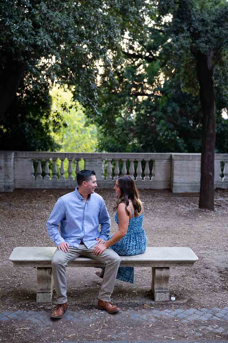 Sitting on a marble bench taking just engaged photos