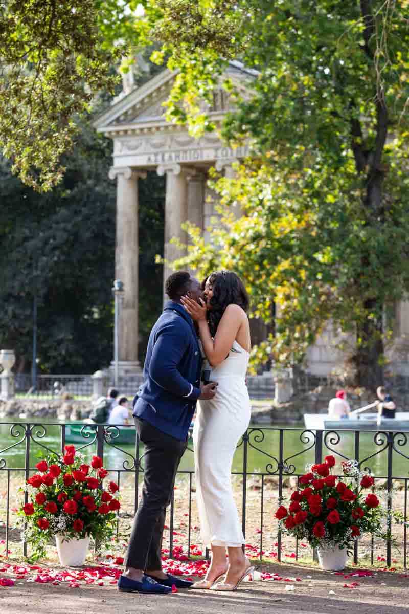 She said yes moment to a romantic wedding marriage proposition photographed among beautiful red roses 