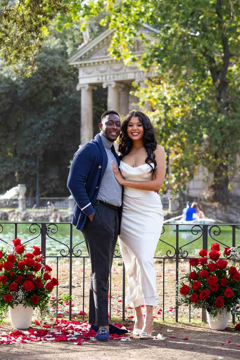 Posed couple portrait taken by the lakeside in the park 