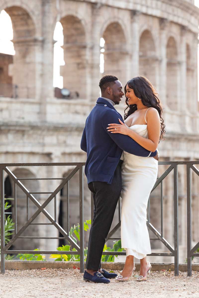 Standing close together while taking pictures together Coliseum