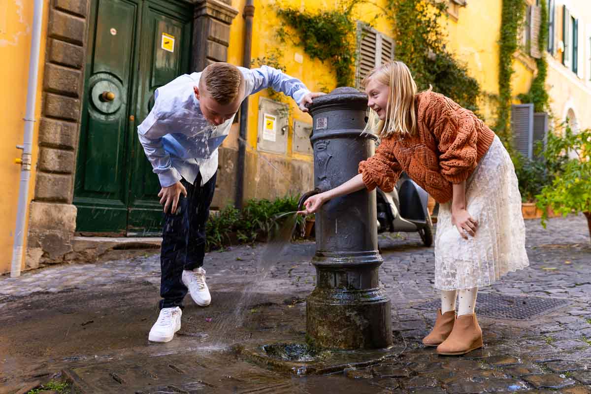 Having fun with a water fountain during a photo taking and pictures in Roma