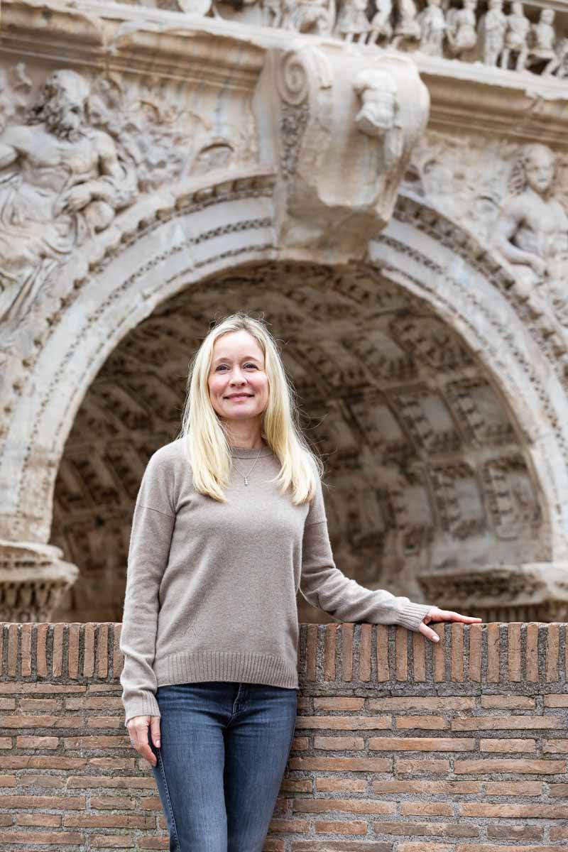 Solo portrait picture taken in front of the arch of septimius severus looking in the distance