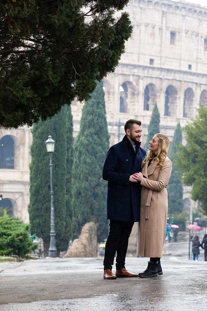Standing in a park with the Colosseum in the background