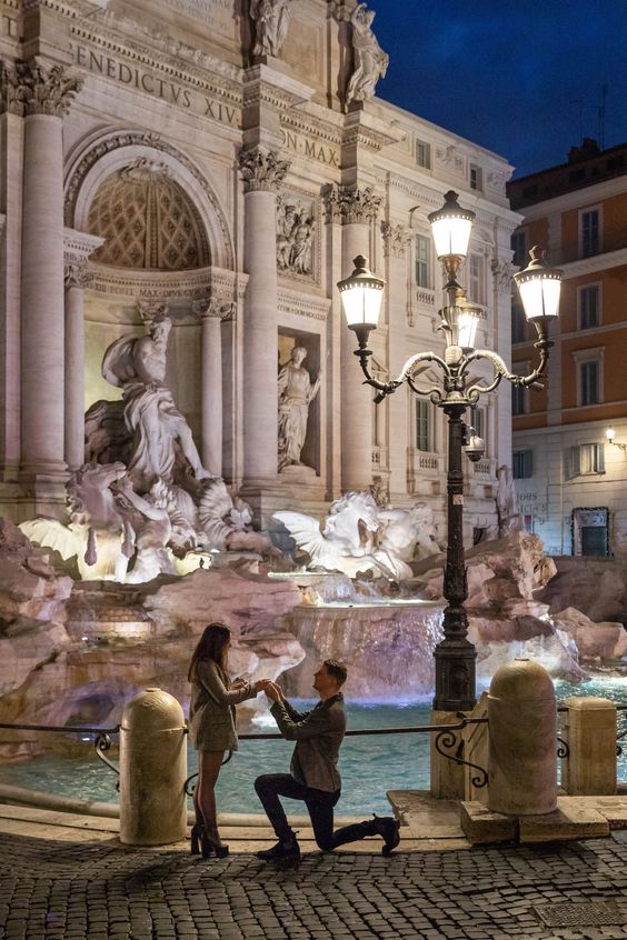 Early morning proposal at the Trevi fountain candidly photographed by our Rome proposal photographer