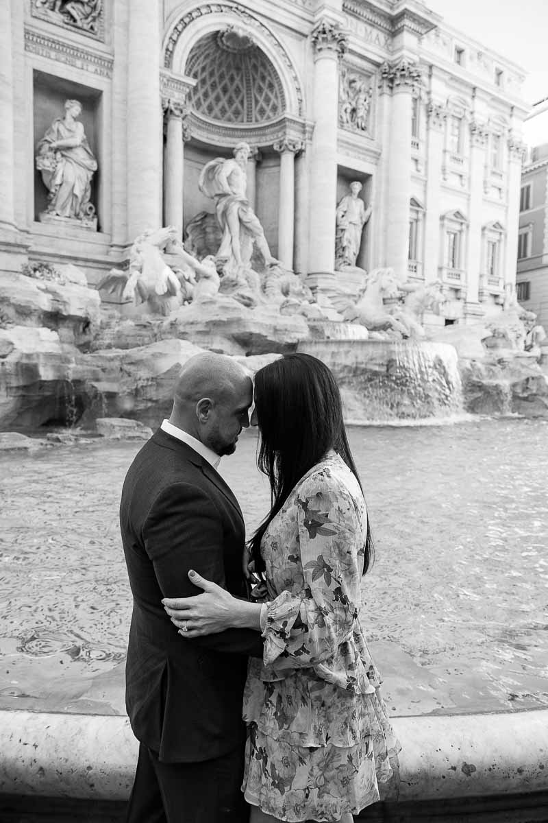 Trevi fountain black and white pictures taken of a couple during their engagement photo shoot