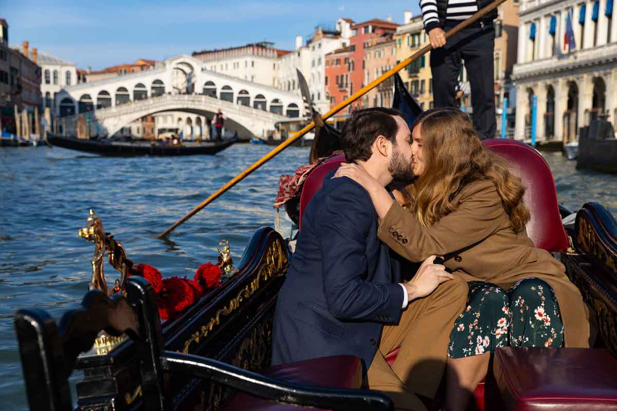 Just engaged to be married on a ride on venetian canals with Rialto background photographer Italy 
