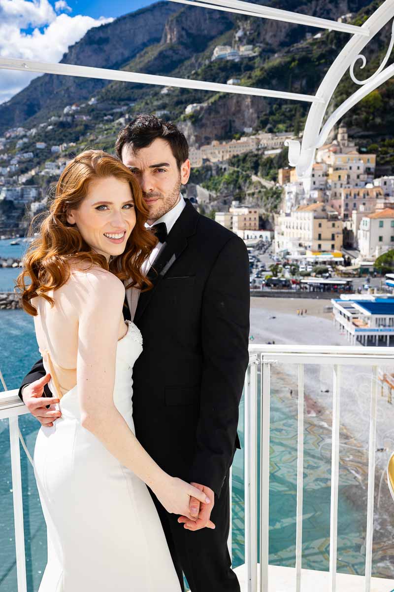 Just married in Italy in the Amalfi town and taking elopement pictures by the coast on a private hotel terrace. Wedding photography couple portraits 