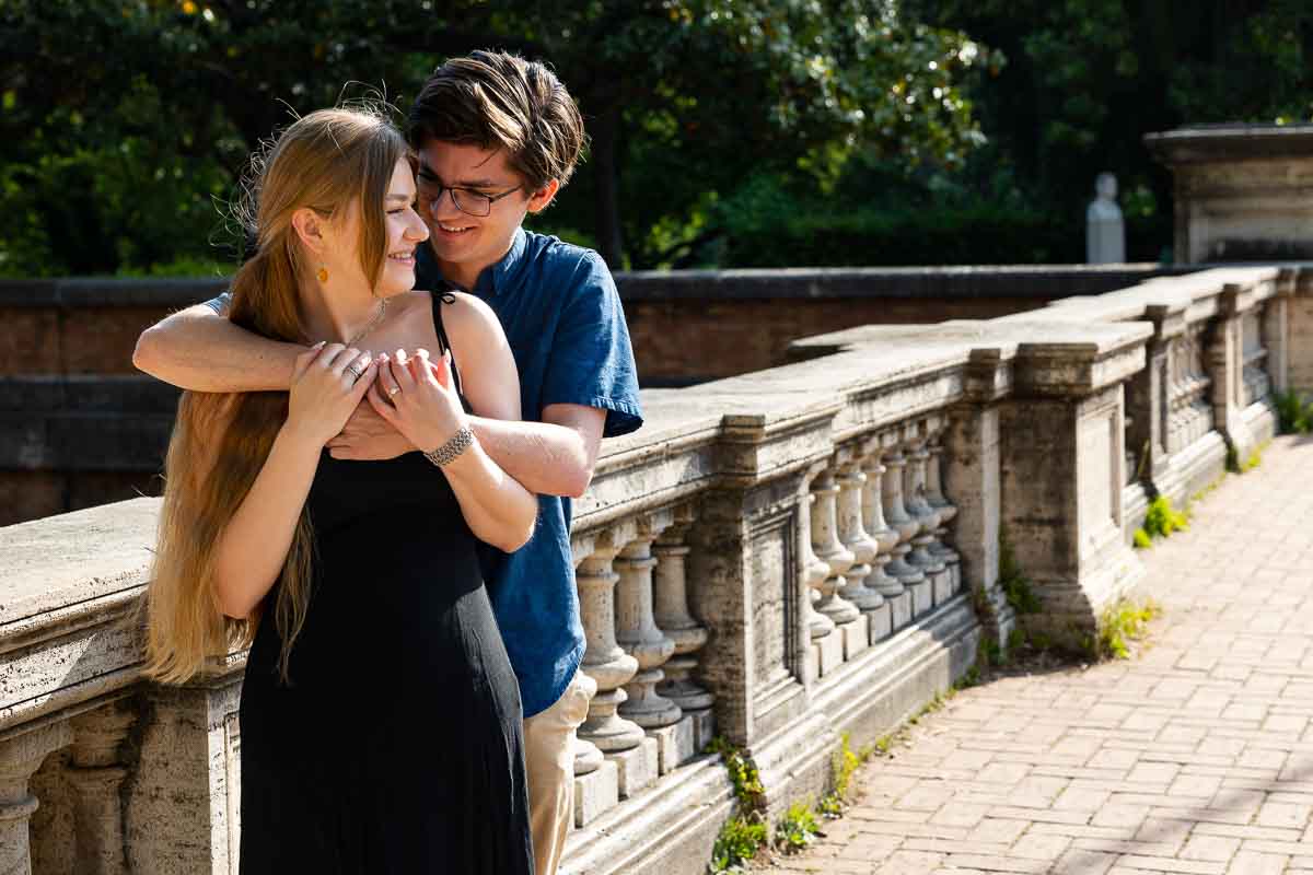 Couple portrait embracing next to an ancient marble railing