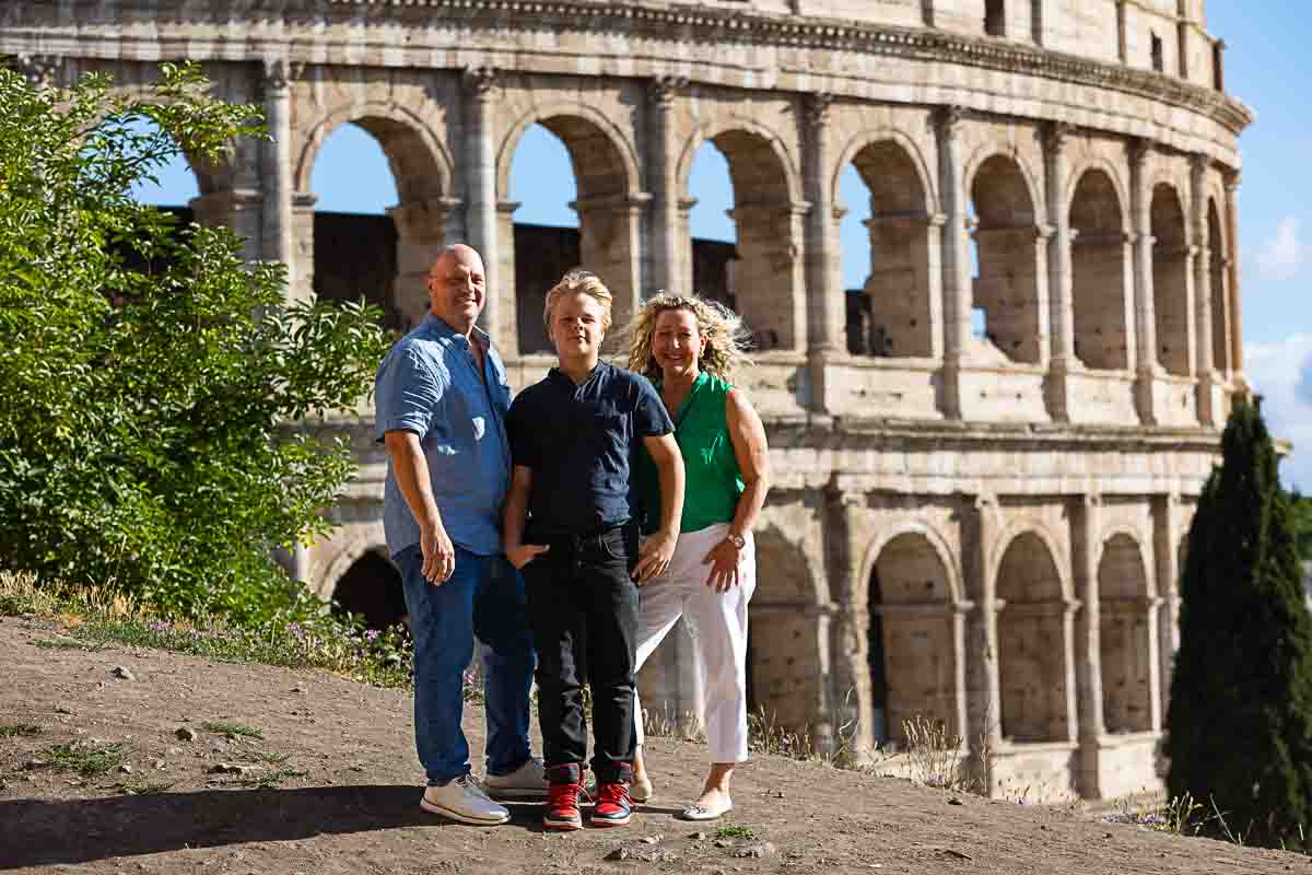 Standing up before the majestic Colosseum during a photo shoot