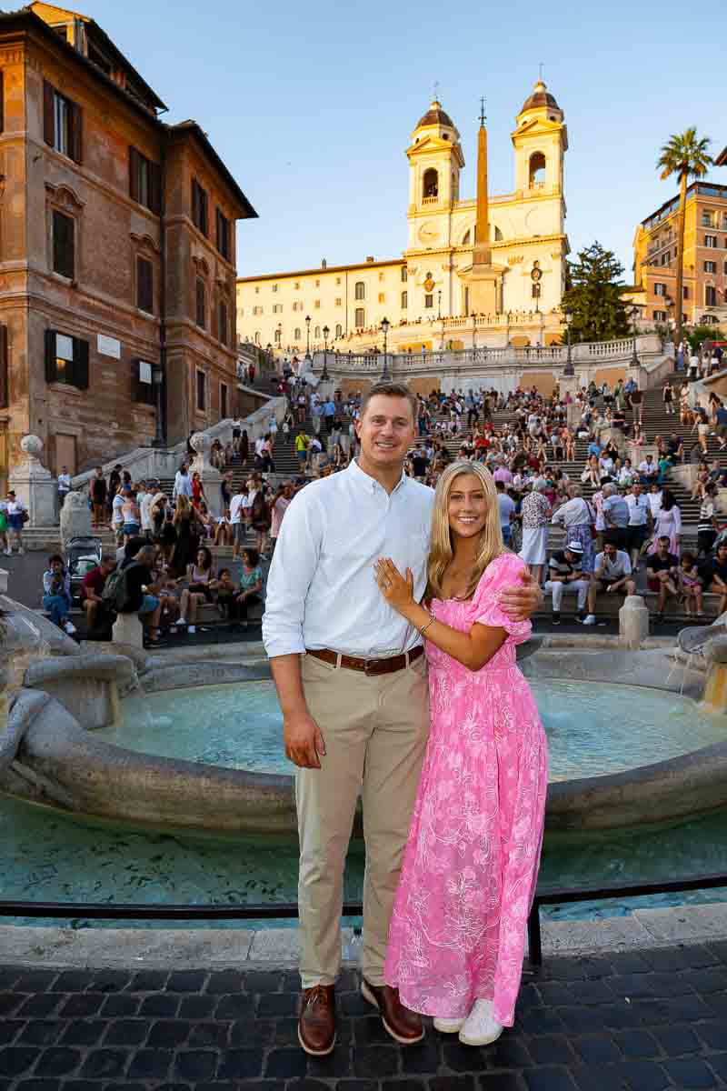 Standing in front Spanish steps for an engagement photo shoot at Piazza di Spagna