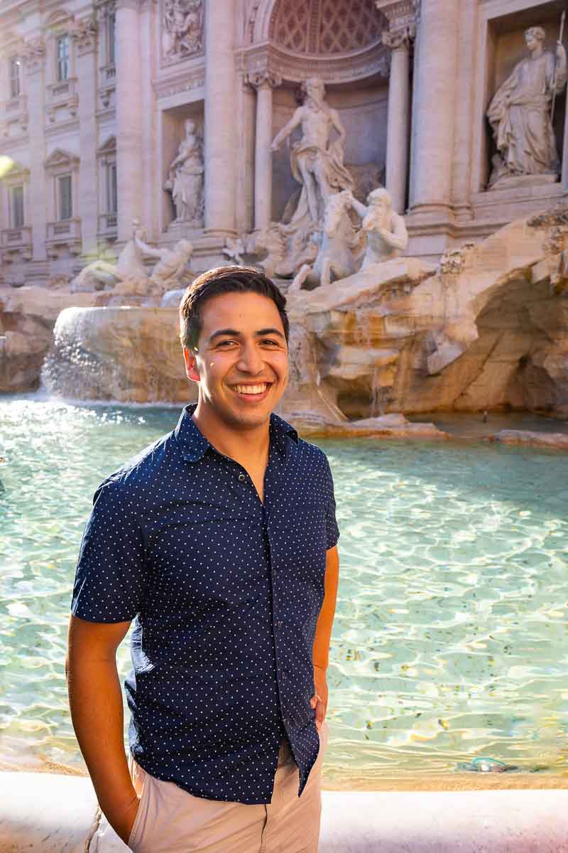Man portrait taken at the Trevi fountain as a senior picture