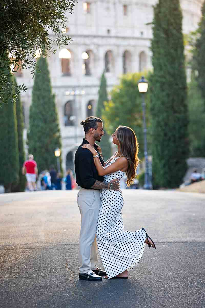 Standing together in a street posing after a beautiful surprise wedding engagement