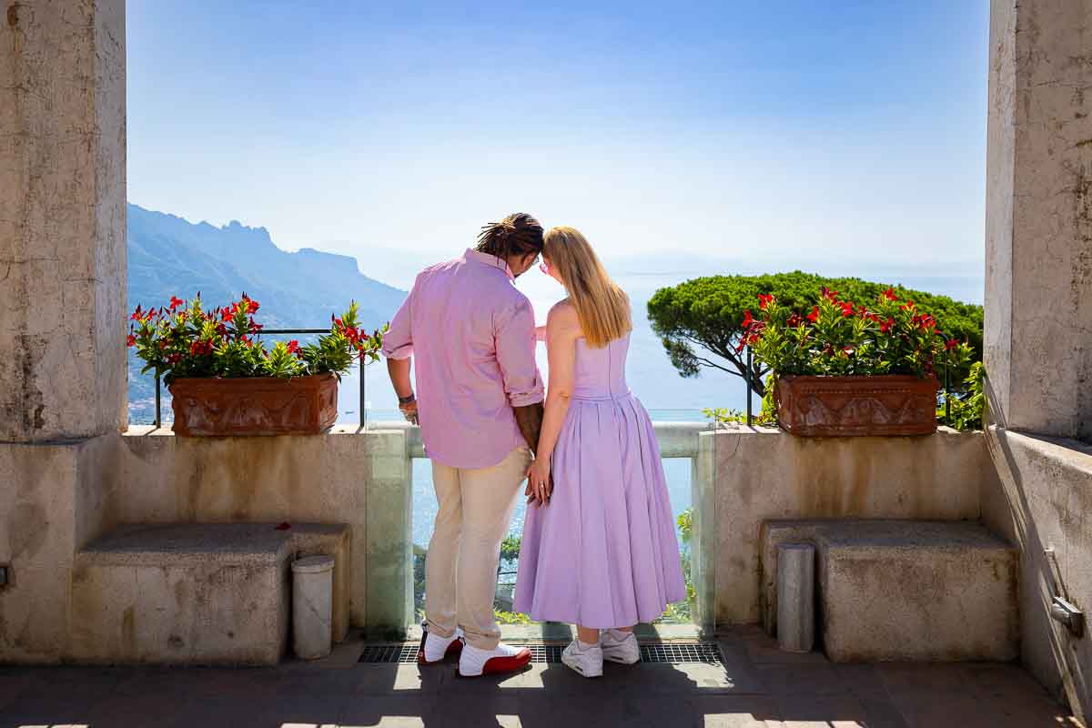 Couple together admiring the view of the coast of Amalfi in Italy