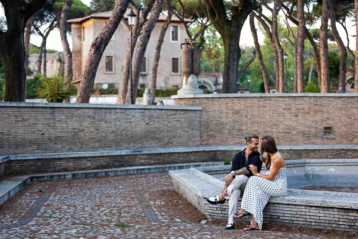 Sitting down by a water fountain Italy during a lifestyle photoshoot