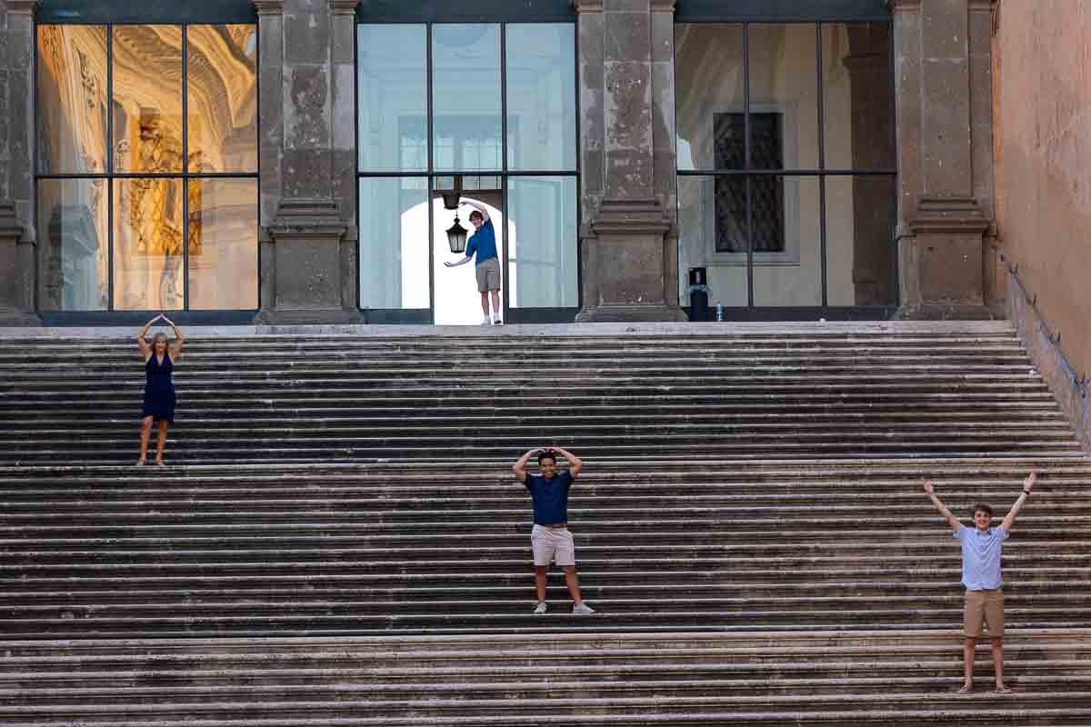 Group photos standing on a large staircase