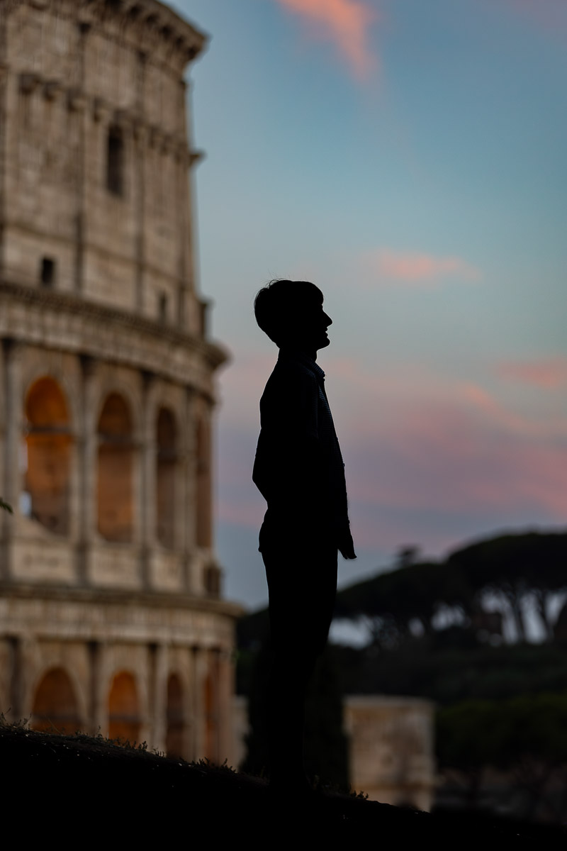 Silhouette sideway portrait at dusk Colosseum