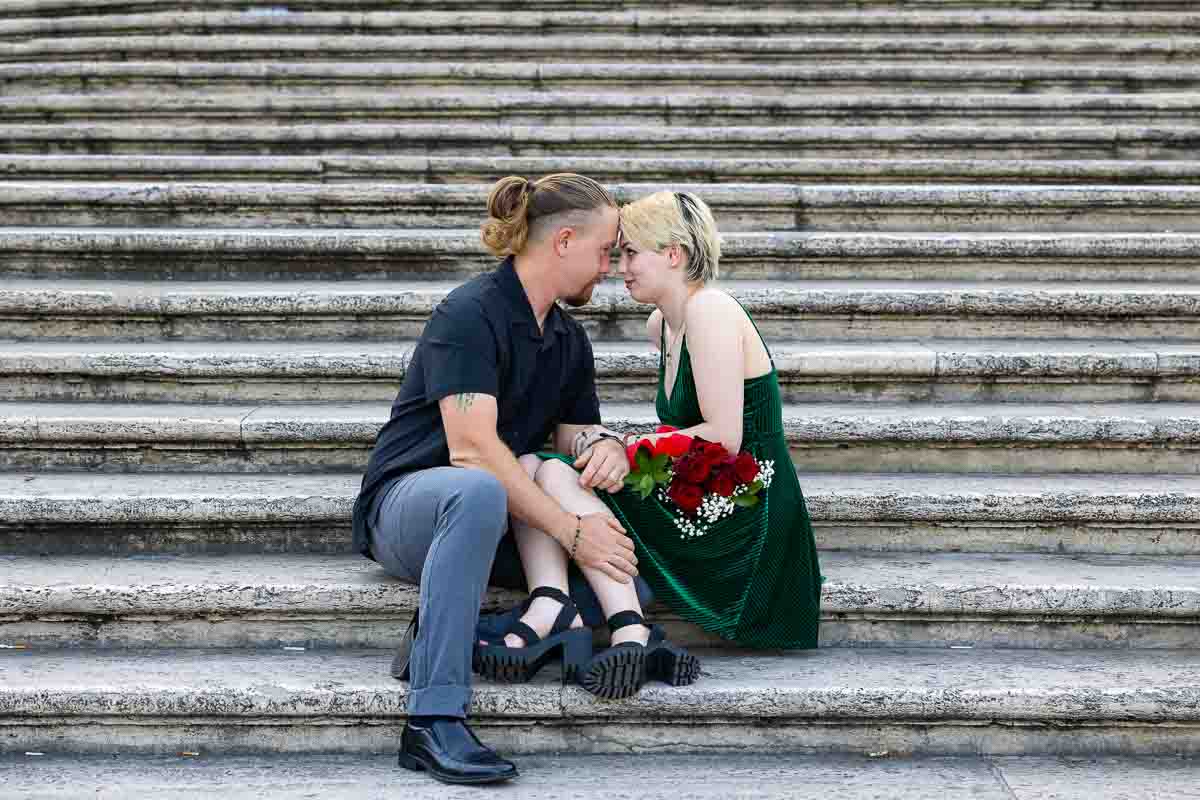 Close up couple sitting down steps of Piazza di Spagna