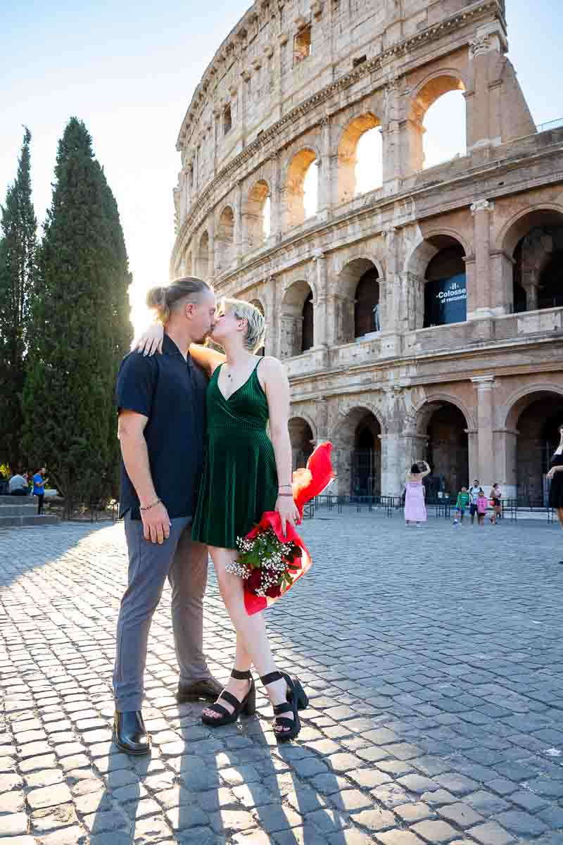 Couple at the Roman Colosseum as the sun ascended at dawn