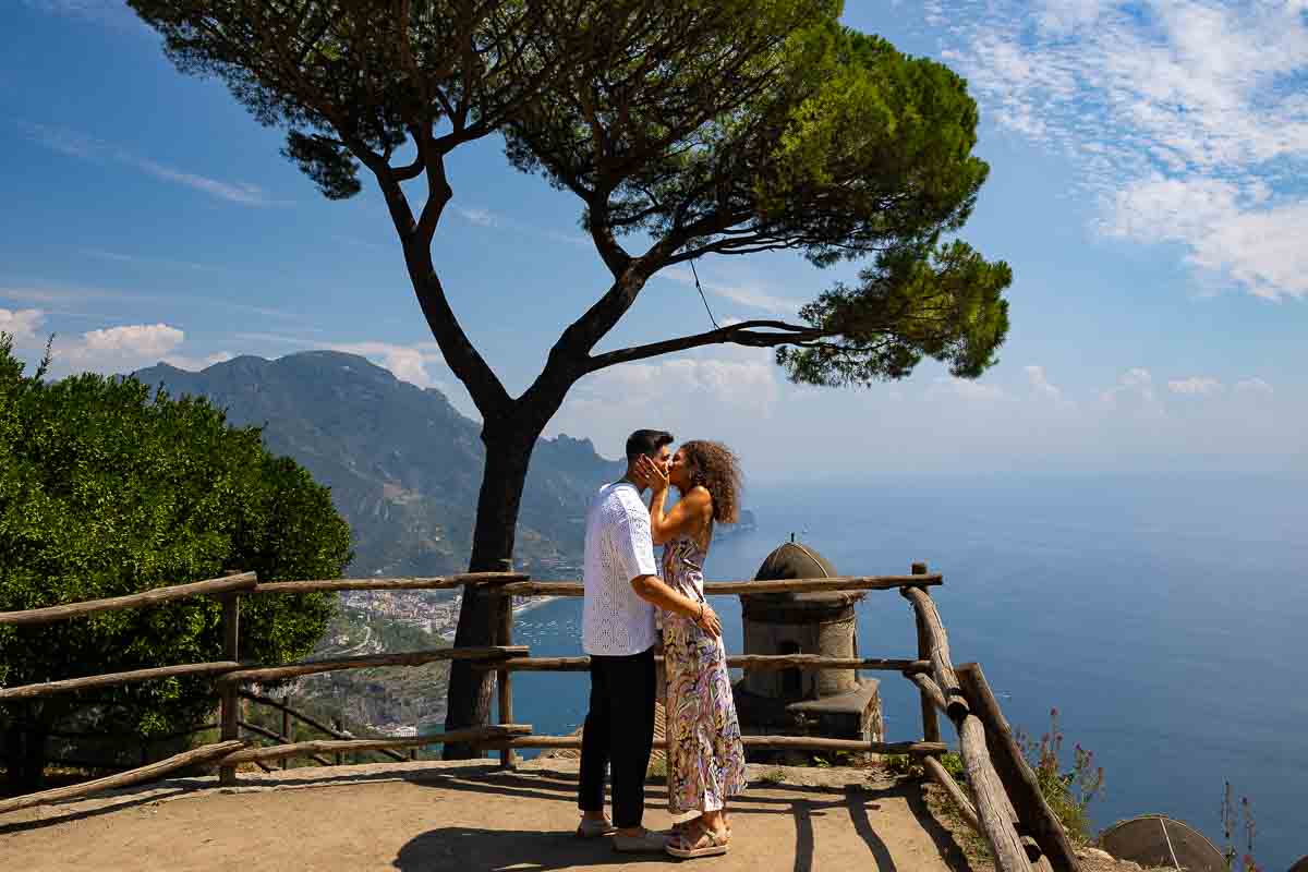 The she said yes moment perfectly photographed from a distance by a photographer in Italy