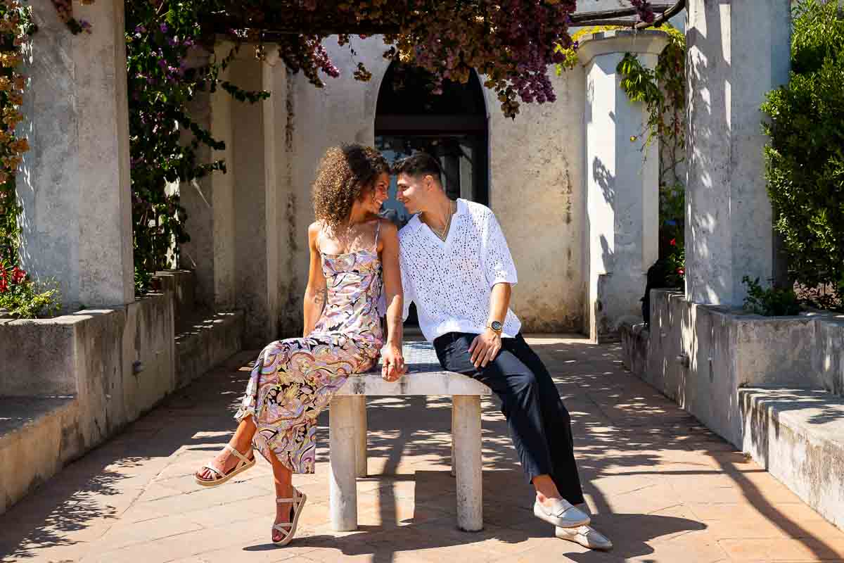 Sitting down next to one another during a photographer session taking portrait pictures