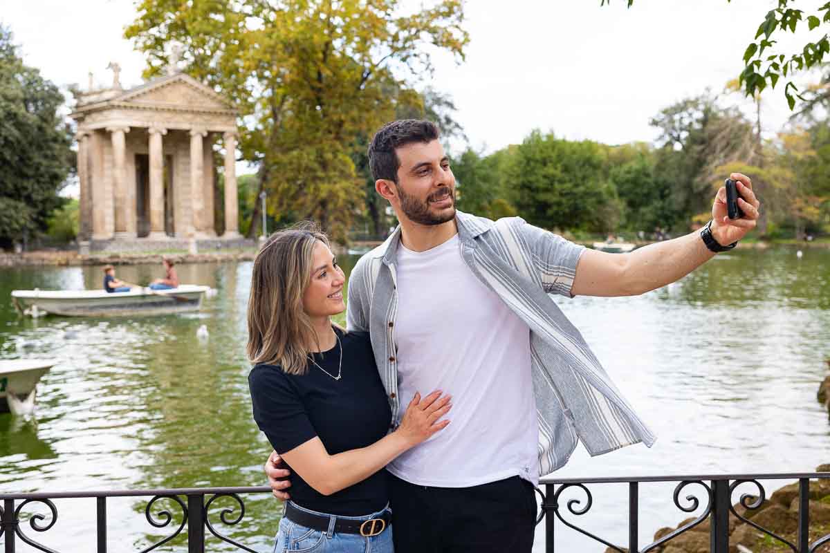 Couple taking a selfie at the Villa borghese park